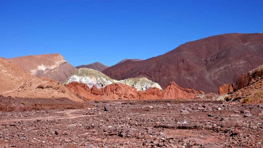 From San Pedro de Atacama: Rainbow Valley Tour - Yerbas Buenas petroglyphs: the human layer under the geology